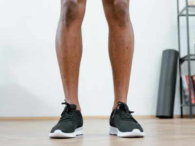 Close-up of athletic shoes on a gym floor before a workout.